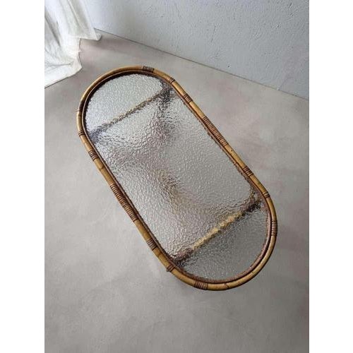 This compact oval rattan coffee table by TRIO in Noordwolde exudes 1960s craftsmanship. A refined design that blends...