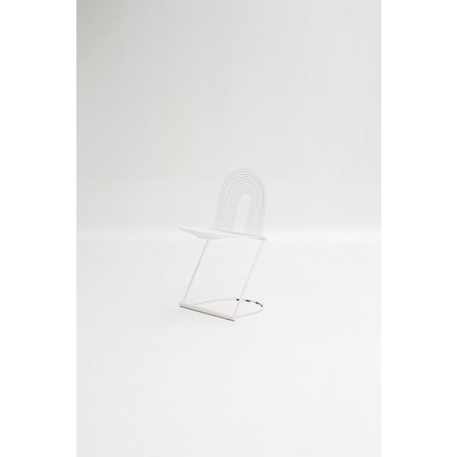 Pair of “Swing” chairs designed by Jutta & Herbert Ohl in the 1970s. with their chromed tubular steel frame and suspended...