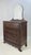 American Empire period dresser with mirror. Constructed with beautiful flame mahogany veneers, the dresser features a...