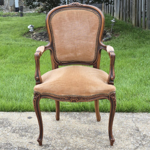 This is an elegant Louis XV style fauteuil arm chair by Italian furniture maker Chateau d’Ax. The chair features a carved...