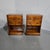 A very nice pair of yew wood three drawer campaign bedside lamp tables with green leather slide, inset brass straps and...