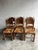 Introduction Authentic set of six solid oak dining chairs dating from the mid-20th century. The chairs feature hand-carved...