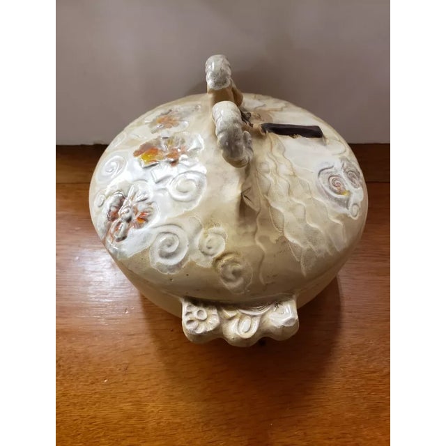 This is a 1973 Pacific Stoneware Lidded Casserole Ram Bowl, Signed Bennett Welsh, Made in USA. It measures 8 1/2" high to...