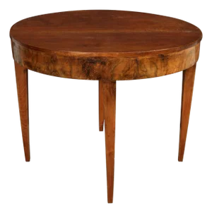 An Oval Mahogany Table With Tapered Legs