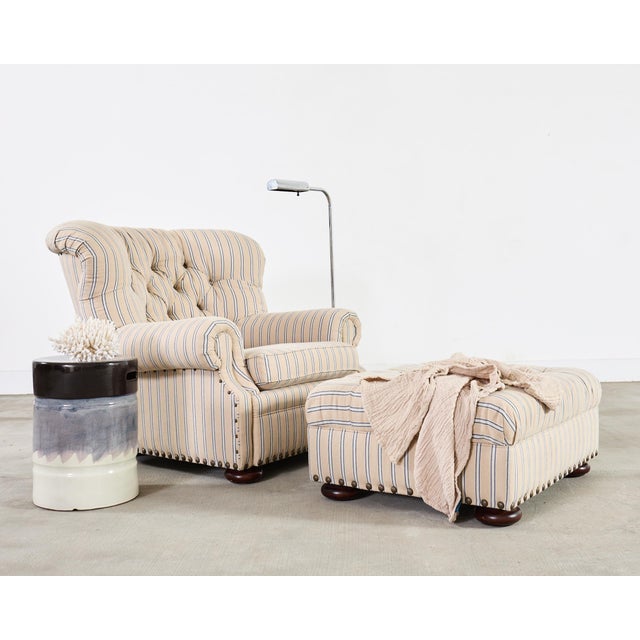 A handsome Ralph Lauren Home Writer’s Chair and matching oversized tufted writer's ottoman finished in Ralph Lauren's...