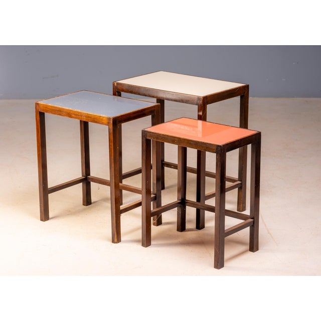 A beautiful set of three Art Deco nesting tables produced in Czechoslovakia during the mid-20th century. Featuring elegant...