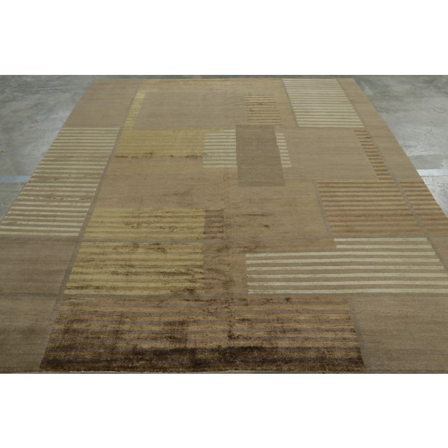 Hand-knotted in Nepalese silk, this 8x10 rug is a bold new addition to Rug & Kilim’s Modern collection of rugs. On the...