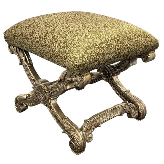 Elegant and richly detailed upholstered bench featuring a carved base inspired by French Empire and Neoclassical design....