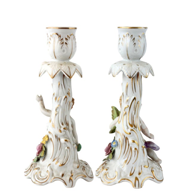 Pair of porcelain candle holders by Von Schierholz, circa 1930s-40s. These vintage pieces feature cherubs with hand-...