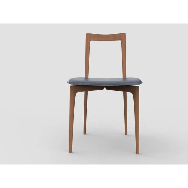 with its light and solid wood structure, this chair is suitable for contemporary interiors. Its proportions and reduced...