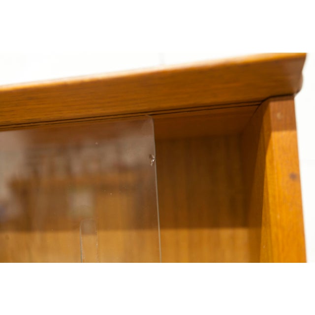 Discover this elegant Oscar low display bookcase, designed by Didier Rozaffy in 1952. Crafted from quality wood with glass...