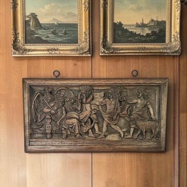 This beautifully hand-carved oak wall plaque depicts what appears to be a Renaissance Revival interpretation of a...
