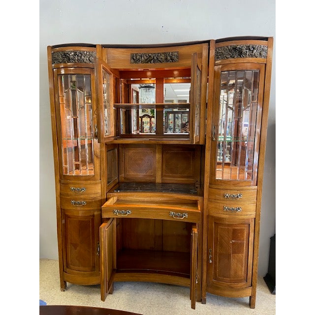 The antique French style marble top buffet with double curio is a stunning piece that effortlessly blends elegance with...