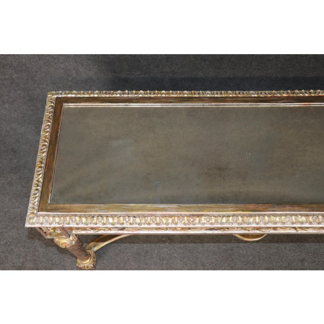 This exceptionally decorative Louis XVI-style console table presents an elegant combination of architectural symmetry,...
