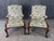 This pair of Baker Furniture Stately Homes Gainsborough arm chairs features beautifully carved wood frames with elegant...