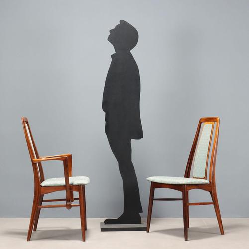 Group of four vintage dining chairs, one with armrests, with exposed wooden frame, fabric seat and back. This piece is...