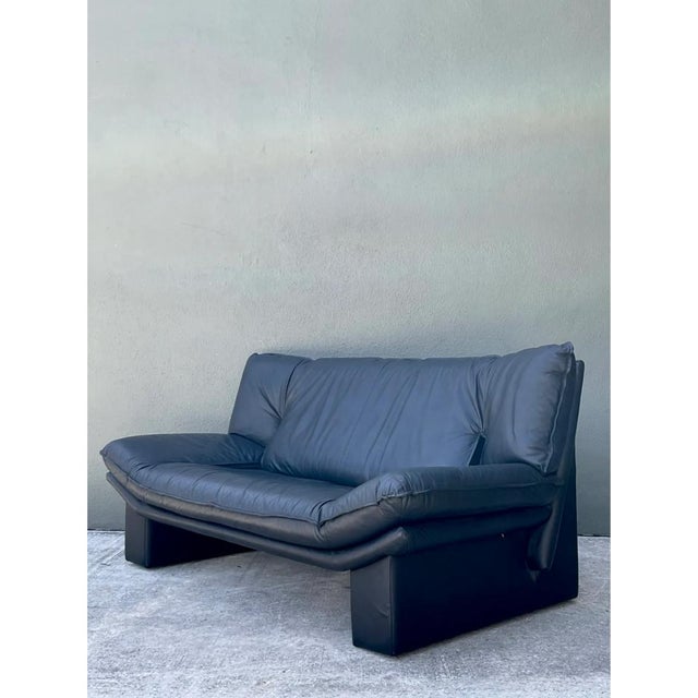 Crafted in Italy during the late 20th century by renowned maker Nicoletti Salotti, this vintage leather sofa captures the...