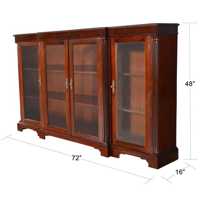 Our version of a breakfront bookcase, this is the Niagara Furniture Four Door Bookcase. The shape of the piece with the...