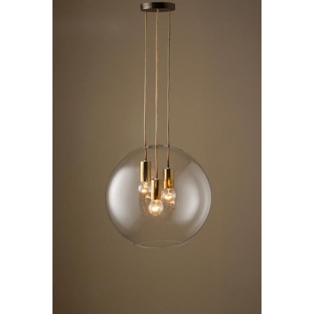 Produced in Sweden, 1960s. Listed price is for a single pendant. Measures: Diameter 40 cm Height: 100 cm (adjustable) Up...