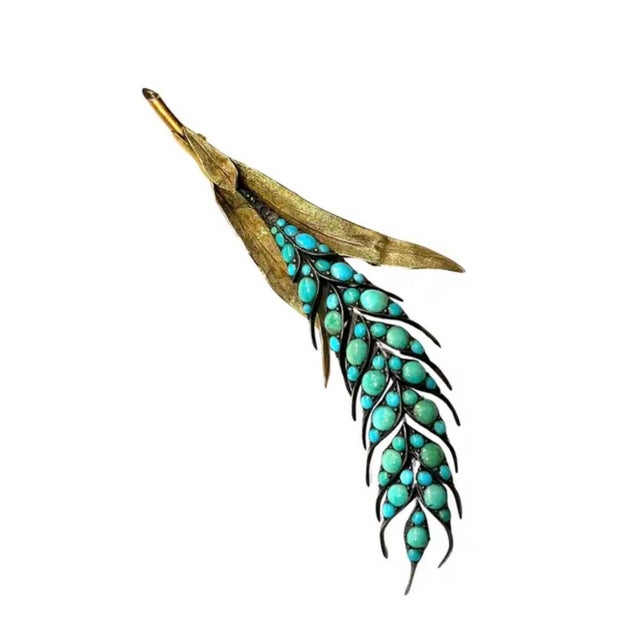 4K Gold and Turquoise Vintage Leaf-Form Brooch. Elegantly elongated, the form is sculpted with textured gold leaves that...