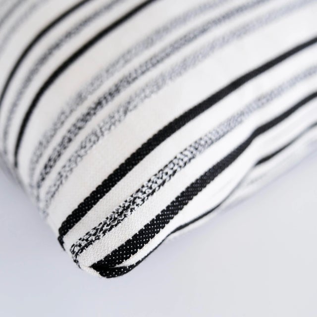 This pillow features Poplar with a Knife Edge finish. This miraculous indoor/outdoor stripe features raised, multi-...