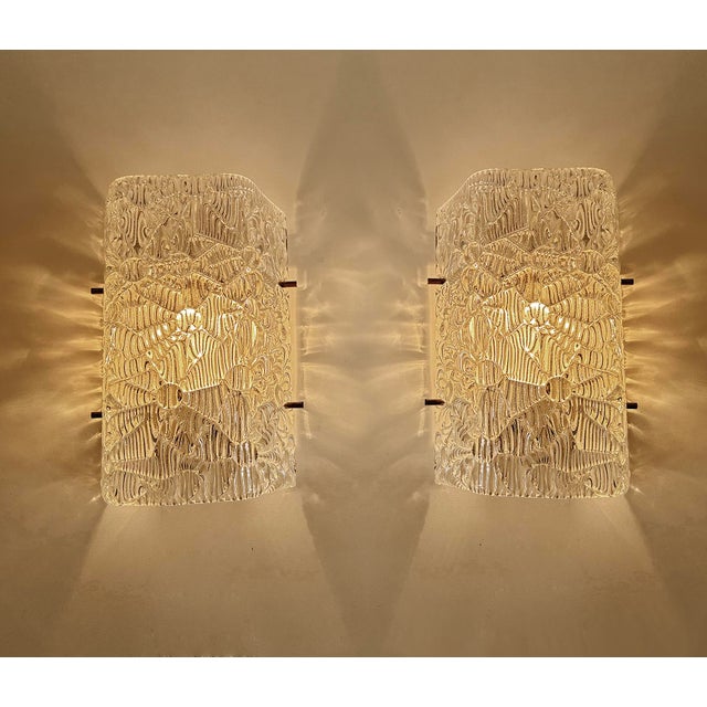 Vintage kalma sconces, tent shaped murano glass mounted on a discreet white enameled base, chrome pins, a third is...