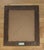 Rendered in oil on canvas, this tender portrait utilizes a soft, muted palette of earthy browns, sage greens, and pale...