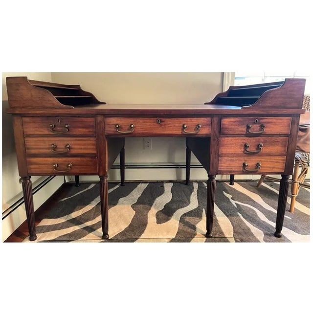 . Mahogany wood partner's desk . Fluted legs . Original brass handles & brass trim keyhole . Each partner's side has 6...