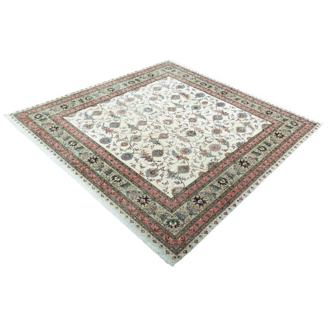 This magnificent, almost square Tabriz 50 Raj rug with silk content is a masterpiece of traditional knotting. with an...
