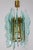Amazing Mid - Century Fontana Arte chandelier. Chrome frame with precious green colored Hammered cut-glass. Available an...