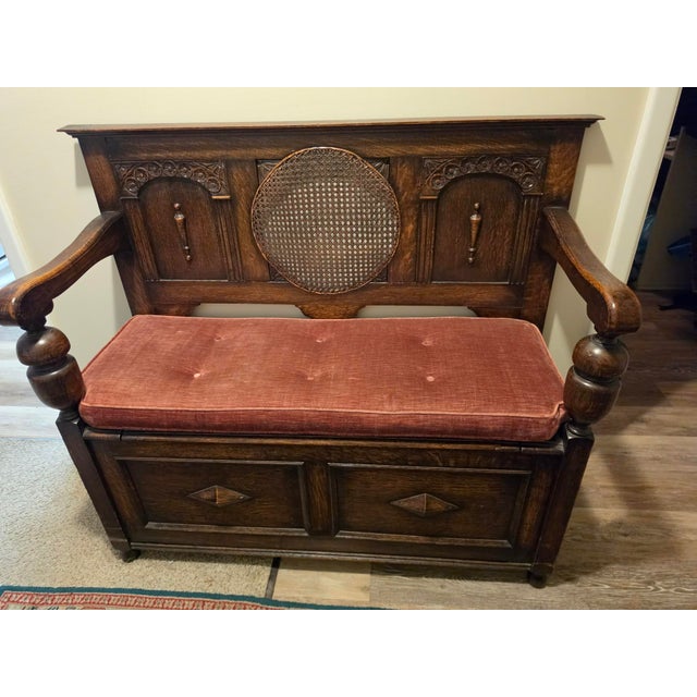 Oxblood Red Antique Oak Hall Bench Features Intricate Carvings and a Circular Cane Insert in the Backrest, Late 19th Century For Sale - Image 8 of 9