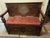 Oxblood Red Antique Oak Hall Bench Features Intricate Carvings and a Circular Cane Insert in the Backrest, Late 19th Century For Sale - Image 8 of 9