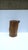 A natural wood pedestal side drinks table, in the Organic Modern style, circa late‑20th century. A rich natural brown wood...