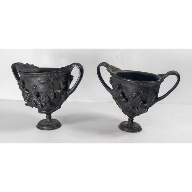 We are selling this pair of Grand Tour Neo-Classical revival urns. These garniture Urns have the same neoclassical style...