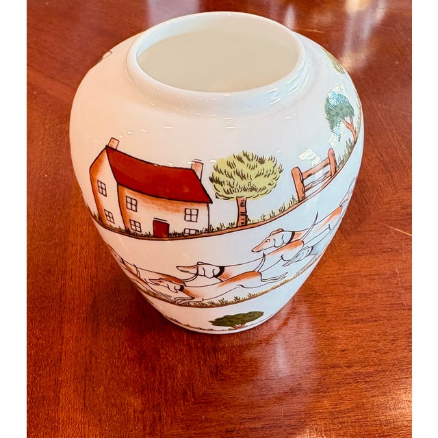 A delightful vintage English fine bone china vase by Crown Staffordshire, decorated in the maker’s charming Hunting Scene...