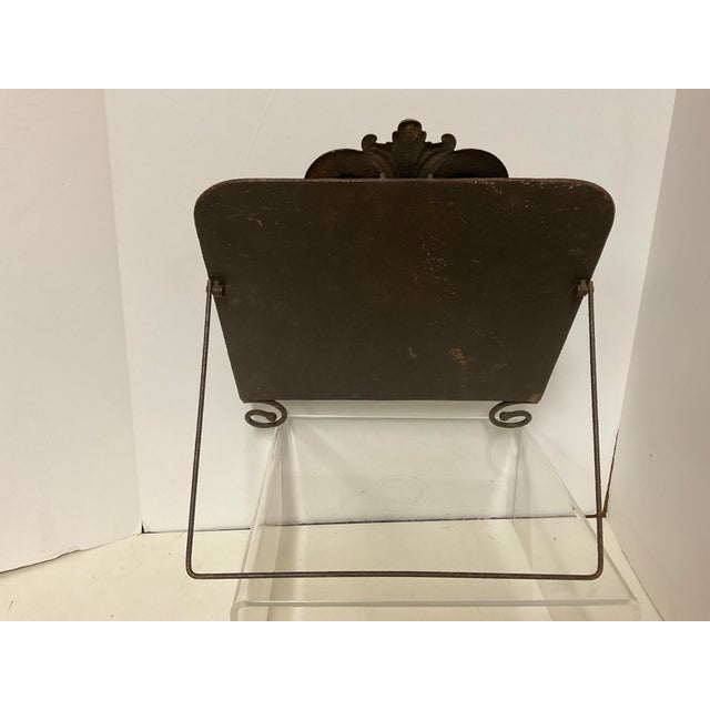 Cast iron decorative items, such as music stands and cookbook holders, were popular in the late 19th and early 20th...