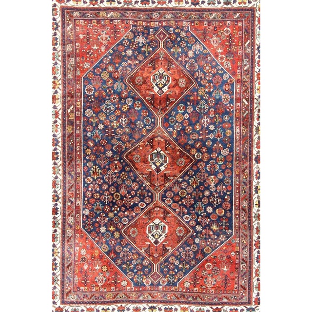 Persian Shiraz antique rug in red and blue with Medallion geometric design, Keivan Woven Ars / rug ema-7567, country of...