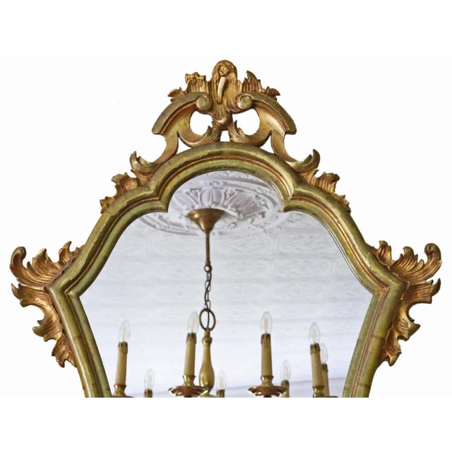 Antique C1900 Gilt Wood Overmantle Wall Mirror – . This mirror features a striking design, making it a captivating...