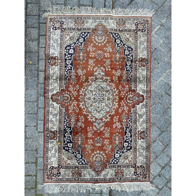 Beautiful vintage silk rug in the style of Middle Eastern Qom rugs, meticulously hand-knotted in China. This exquisite...