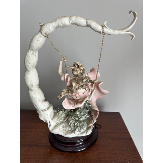 Crafted with a passion for artistry, the Florence Giuseppe Armani "Summertime" sculpture captures the enchanting essence...
