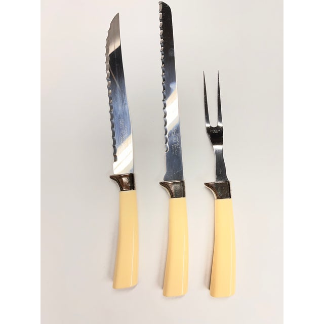 Mid-Century Wavecrest Regent Sheffield Carving set with two knives and a serving fork. Stainless steel and bakelite...