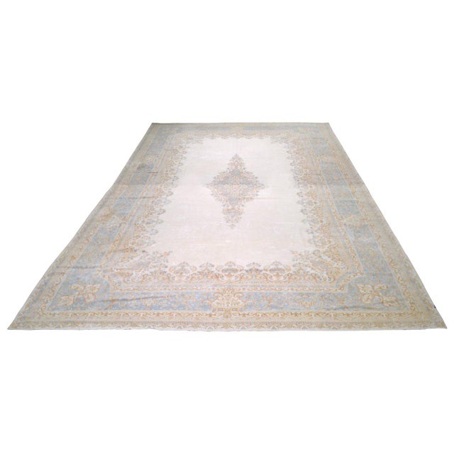 Hand-knotted with care using traditional rug-making techniques, this wool rug blends timeless craftsmanship with a modern...