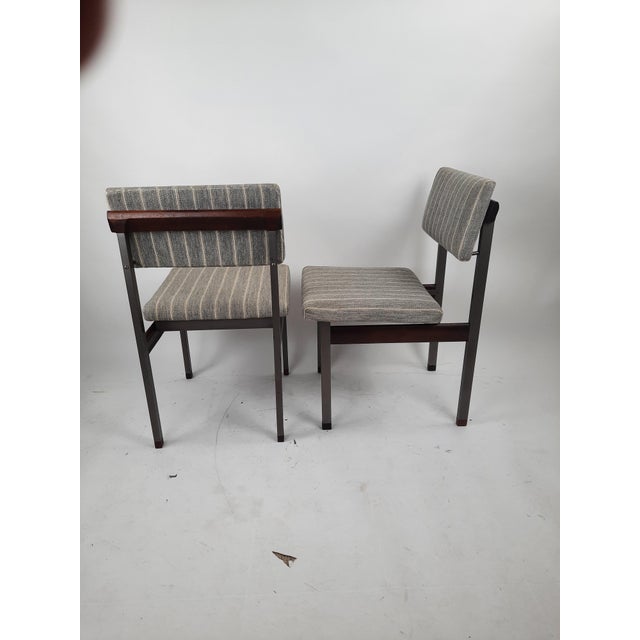 Set of two mid-century dining chairs 'Pali' by Louis van Teeffelen for Wébé. Designed in 1966. Dark grey metal base with...