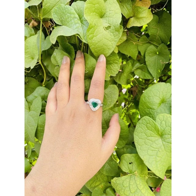 This is part of Chairish’s Fine Jewelry assortment. Emerald Diamond Heart Shape Ring in 18K Gold featuring natural emerald...