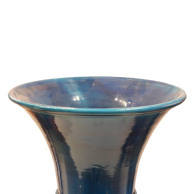 A French Art Deco period tall vase from France circa 1920. The gorgeous blue glazed ceramic enhances the distinctive...