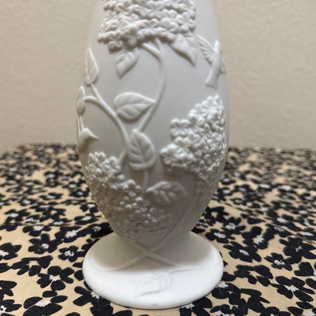 Exhibiting the timeless elegance of German craftsmanship, this vintage white bisque porcelain vase was designed by Cheryl...