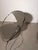 Elegant Italian dining chair by Amben Italy , featuring a sculptural tubular chrome frame combined with grey leather...