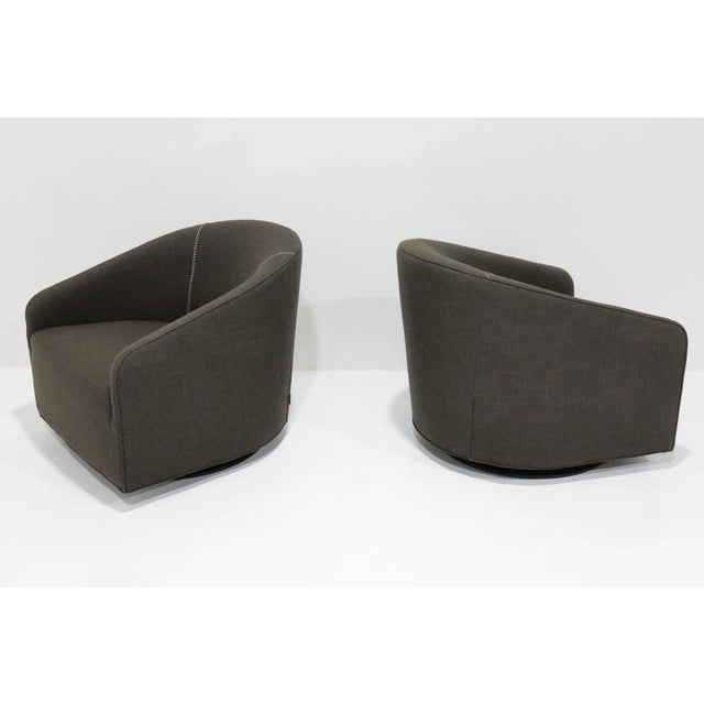 Immerse yourself in timeless elegance with this pair of Minotti Portofino Swivel Lounge Chairs, designed by the acclaimed...