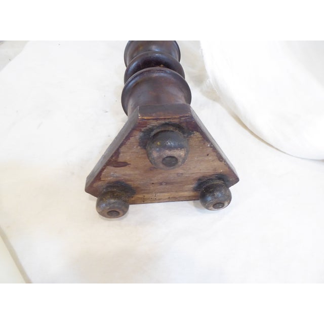 This walnut pricket stick comes with a candle and measures 29"H without the candle and 35"H with the candle.