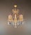 This decorative chandelier is designed in the Venetian style with Rococo Revival influences, featuring gracefully curved...